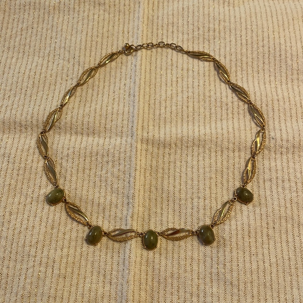 Gold tone metal and green gemstone necklace